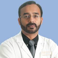Dr. Ajit Tharakan